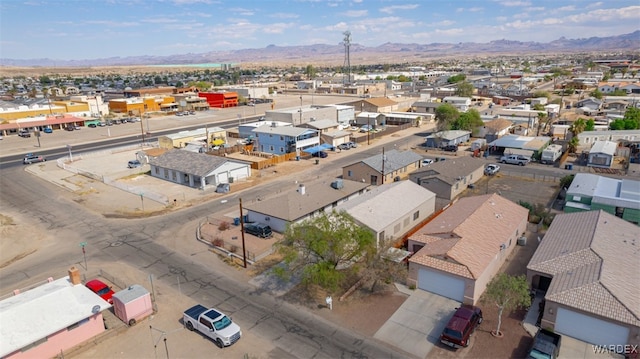 drone / aerial view with a residential view and a mountain view