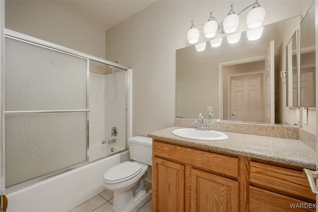 full bathroom with toilet, shower / bath combination with glass door, tile patterned floors, and vanity