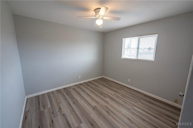 2615 E Devlin Ave, Kingman, AZ 86409 - unfurnished room featuring wood finished floors and a ceiling fan