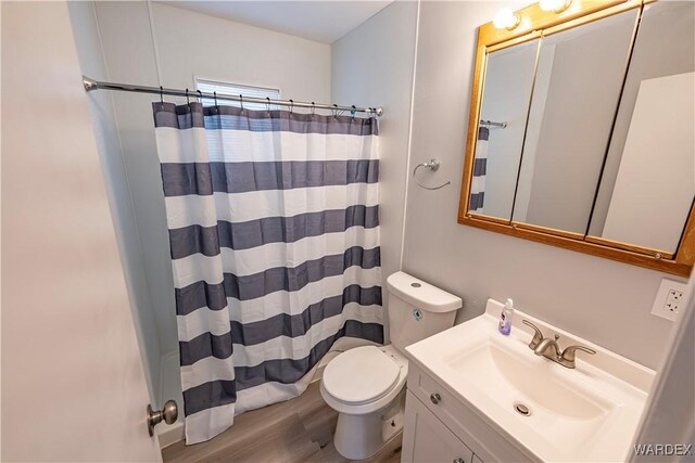 2615 E Devlin Ave, Kingman, AZ 86409 - bathroom featuring vanity, wood finished floors, and a shower with shower curtain