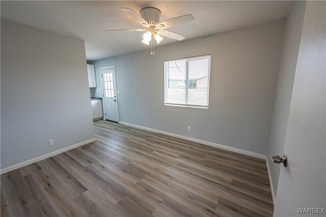 2615 E Devlin Ave, Kingman, AZ 86409 - unfurnished room featuring light wood finished floors and ceiling fan