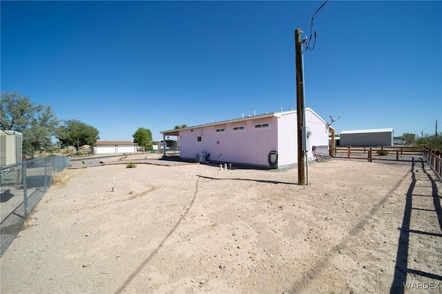 exterior space with an enclosed area and fence