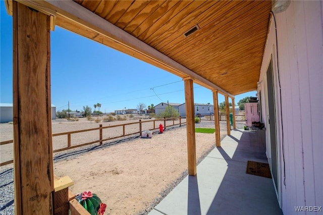 view of patio / terrace featuring fence