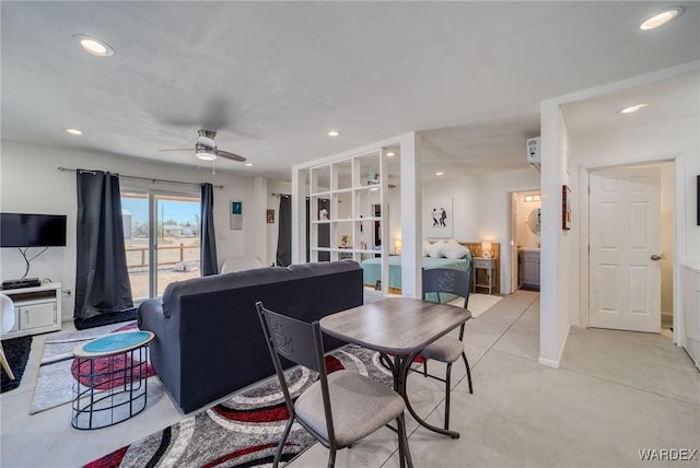 living room with a ceiling fan and recessed lighting