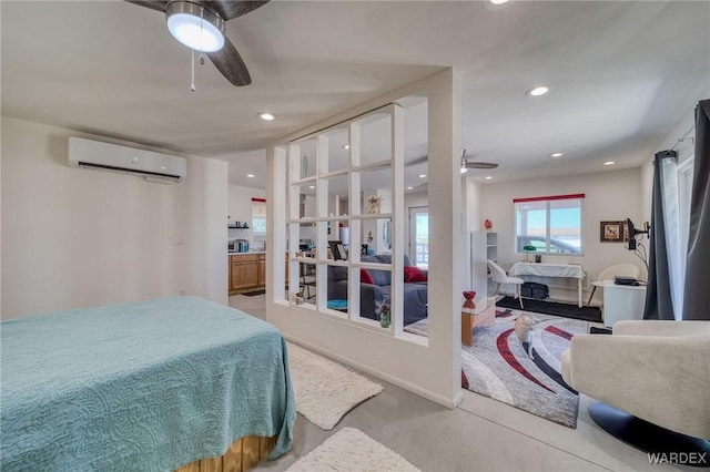 bedroom with a wall unit AC and recessed lighting