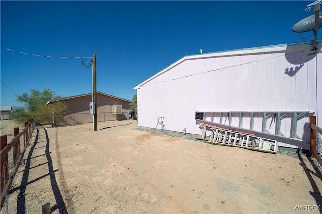 view of property exterior with fence