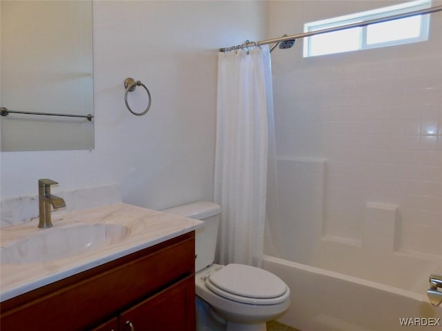 bathroom featuring toilet, shower / bath combination with curtain, and vanity