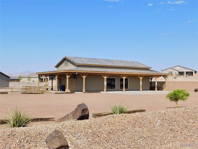 back of property with stucco siding