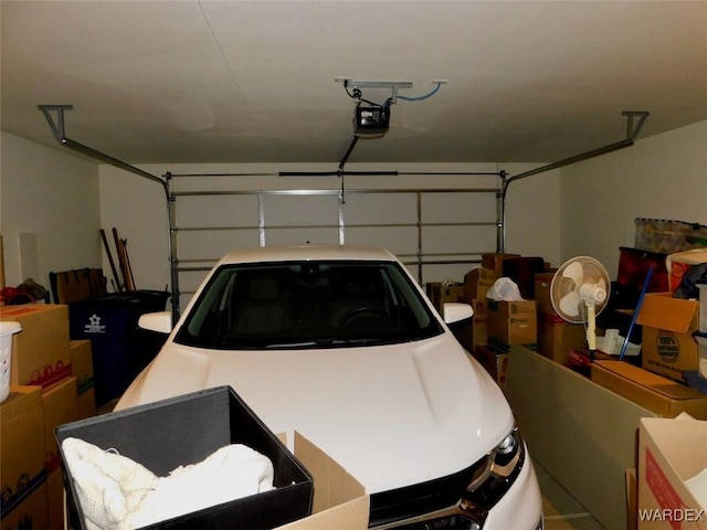 garage featuring a garage door opener