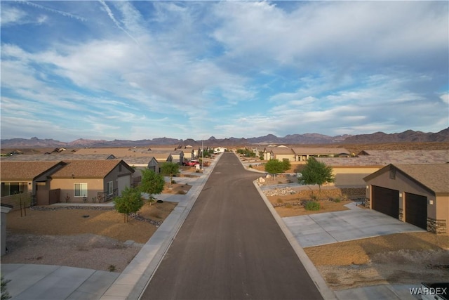 view of street with a residential view and a mountain view