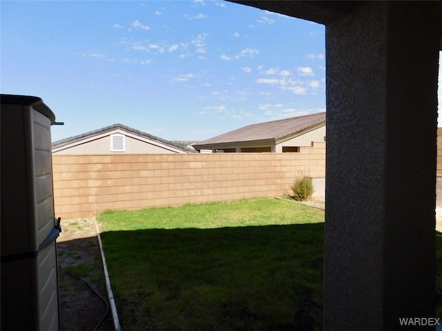 view of yard with a fenced backyard