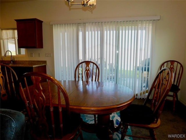 dining space with a notable chandelier and a wealth of natural light