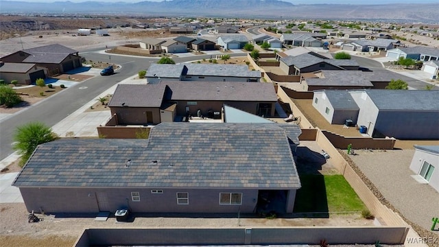 birds eye view of property with a residential view and a mountain view