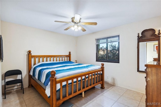 bedroom featuring a ceiling fan and light tile patterned floors