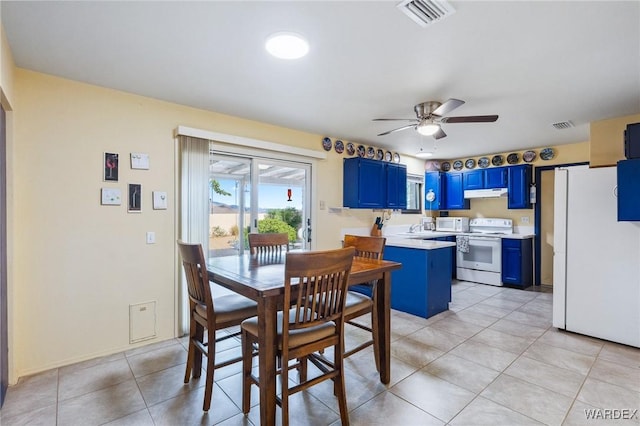 dining room featuring light tile patterned floors, ceiling fan, and visible vents