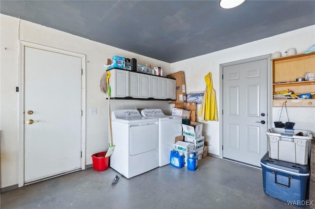 laundry room featuring cabinet space and washing machine and clothes dryer