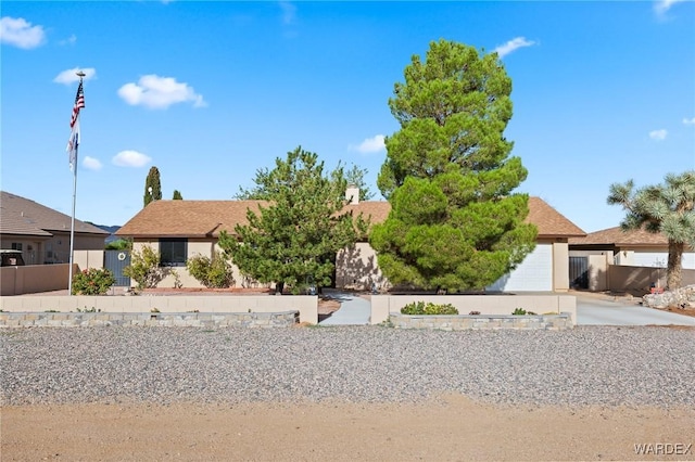 view of front of home featuring fence