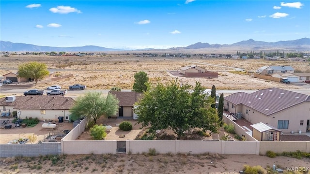 drone / aerial view featuring a residential view and a mountain view