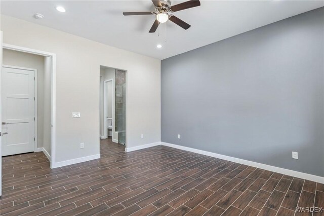 unfurnished room with dark wood-type flooring, recessed lighting, and baseboards