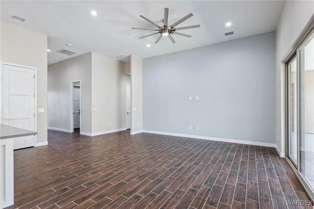 unfurnished room featuring ceiling fan, visible vents, dark wood-style flooring, and recessed lighting