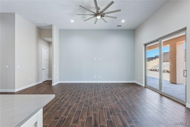 unfurnished room featuring baseboards, dark wood-style flooring, and recessed lighting