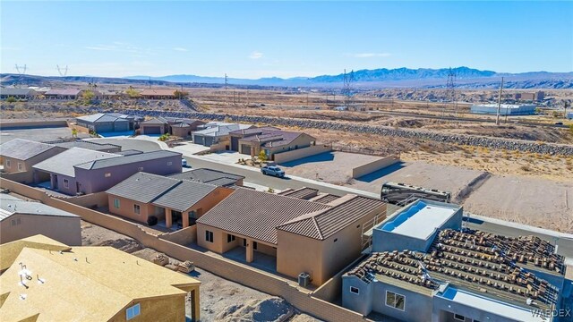 bird's eye view with a residential view and a mountain view