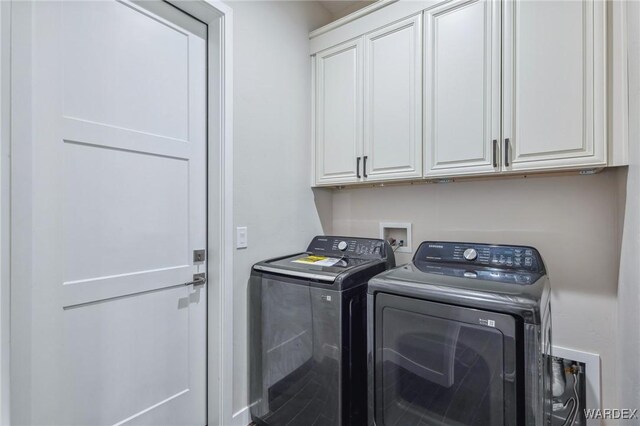 laundry room featuring cabinet space and washer and clothes dryer