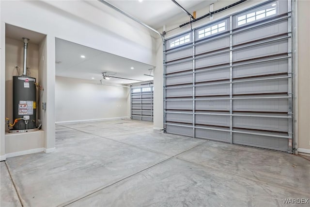 garage with gas water heater and baseboards