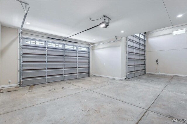 garage featuring baseboards and a garage door opener