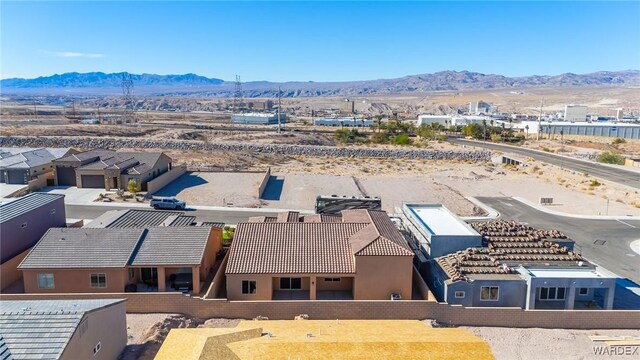 drone / aerial view with a residential view and a mountain view