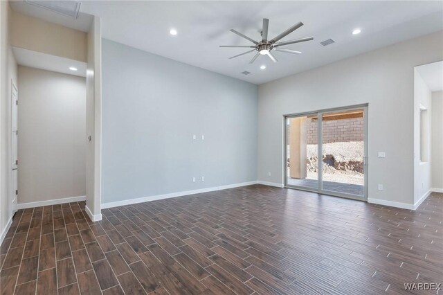 spare room featuring ceiling fan, recessed lighting, visible vents, baseboards, and dark wood finished floors