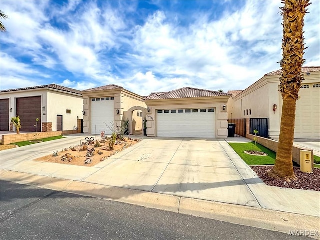 10730 S River Terrace Dr, Mohave Valley, AZ 86440 - view of front of property with driveway, stucco siding, a tiled roof, and an attached garage