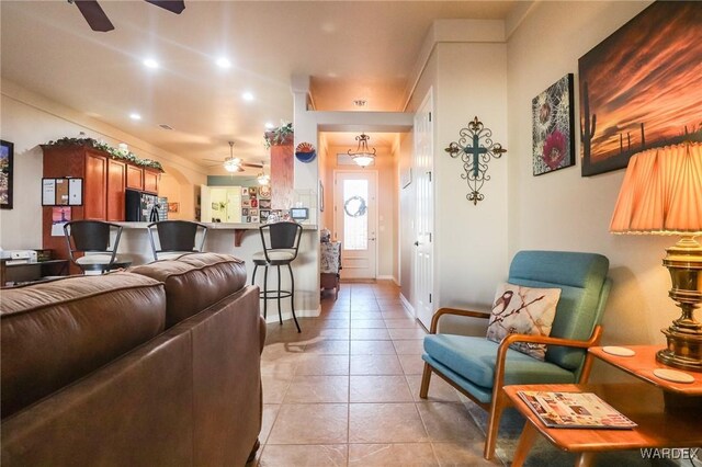 10730 S River Terrace Dr, Mohave Valley, AZ 86440 - living room with recessed lighting, light tile patterned floors, baseboards, and ceiling fan