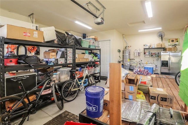 10730 S River Terrace Dr, Mohave Valley, AZ 86440 - storage area featuring a garage and water heater