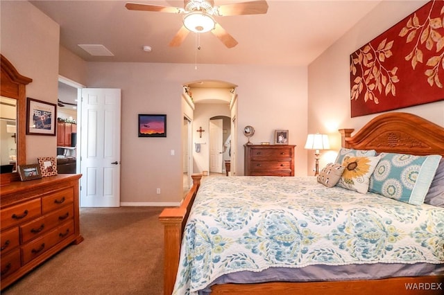 10730 S River Terrace Dr, Mohave Valley, AZ 86440 - bedroom with arched walkways, carpet, baseboards, and ceiling fan