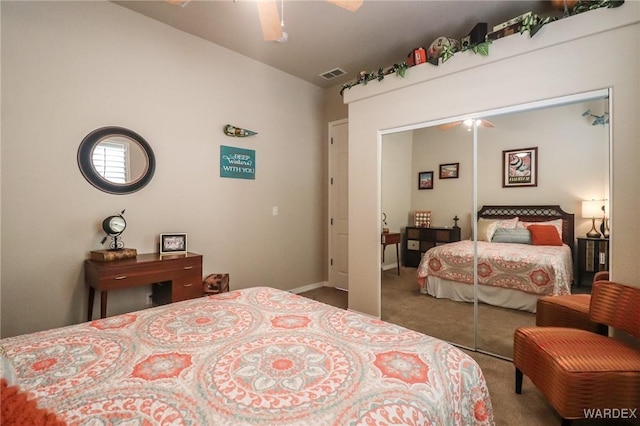 10730 S River Terrace Dr, Mohave Valley, AZ 86440 - carpeted bedroom featuring baseboards, visible vents, a closet, and a ceiling fan