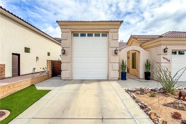 10730 S River Terrace Dr, Mohave Valley, AZ 86440 - exterior space featuring driveway, a tiled roof, and stucco siding
