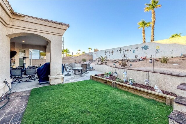 10730 S River Terrace Dr, Mohave Valley, AZ 86440 - view of yard featuring a patio and a fenced backyard