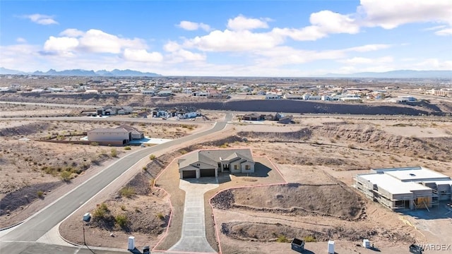 drone / aerial view with a mountain view and a desert view