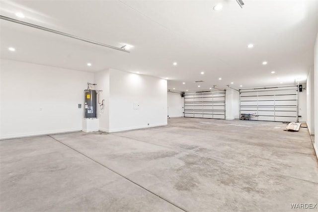 garage with recessed lighting, electric water heater, and baseboards