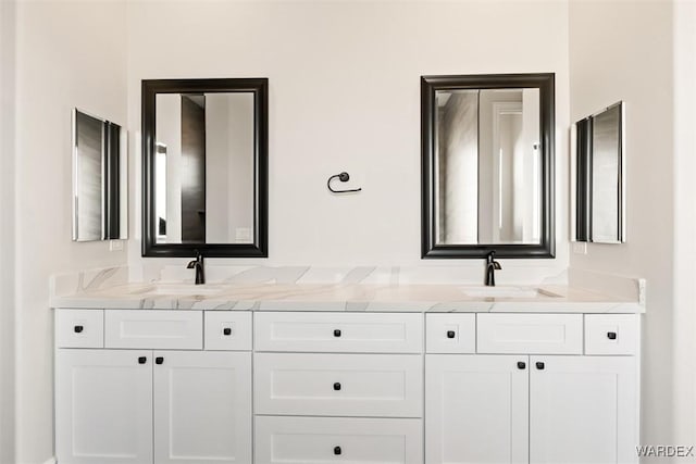 bathroom featuring double vanity and a sink