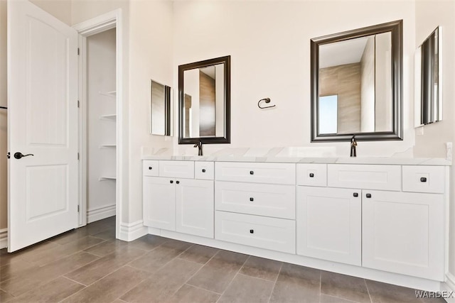 bathroom with double vanity and a sink