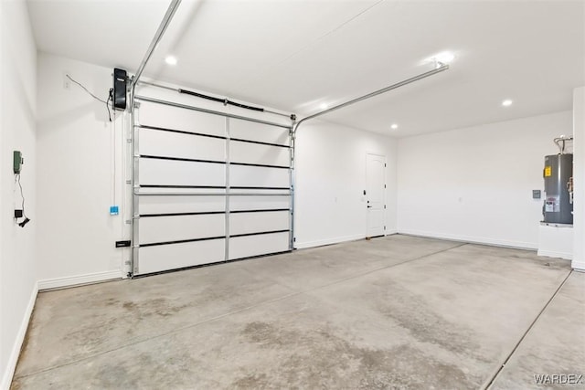 garage featuring water heater and baseboards