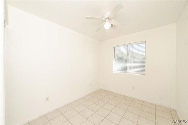 empty room with baseboards and a ceiling fan