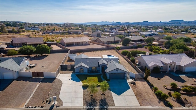 drone / aerial view with a residential view and a mountain view