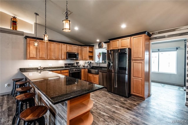 kitchen featuring dark wood-style floors, appliances with stainless steel finishes, a peninsula, open shelves, and a sink