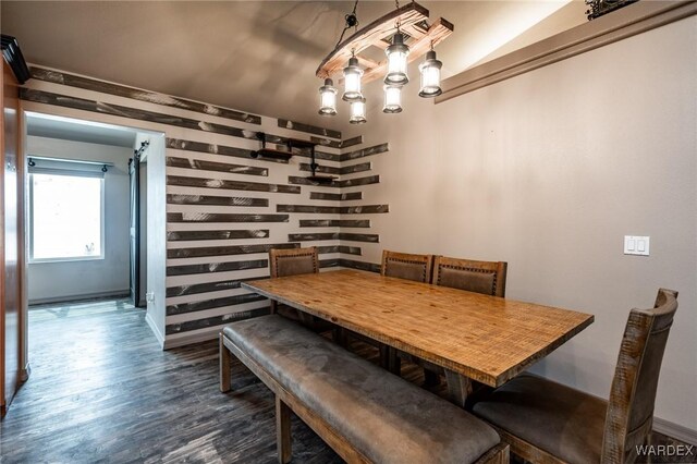 dining area with dark wood-style floors and baseboards