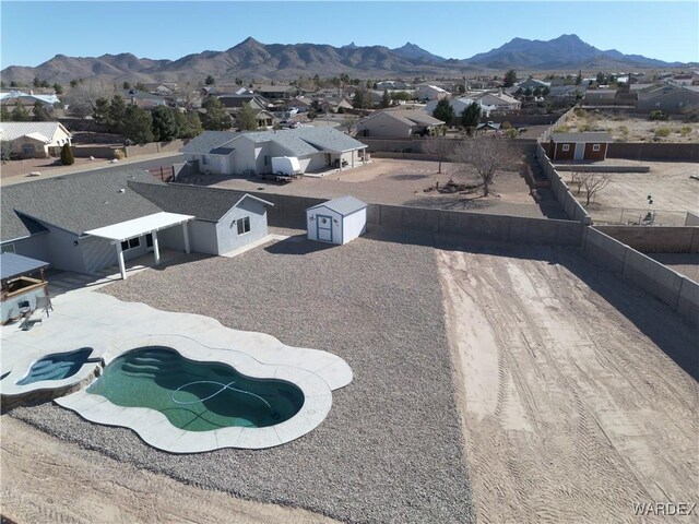 drone / aerial view with a residential view and a mountain view