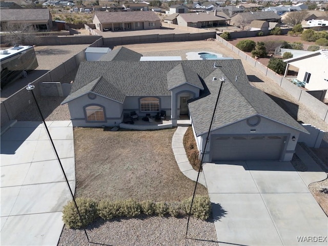 birds eye view of property with a residential view