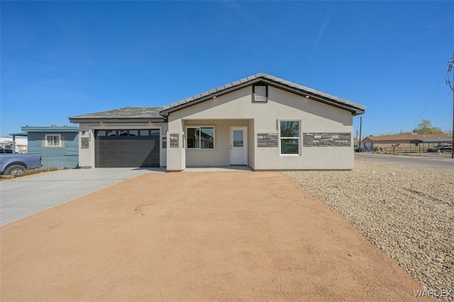 ranch-style house featuring concrete driveway, an attached garage, fence, and stucco siding